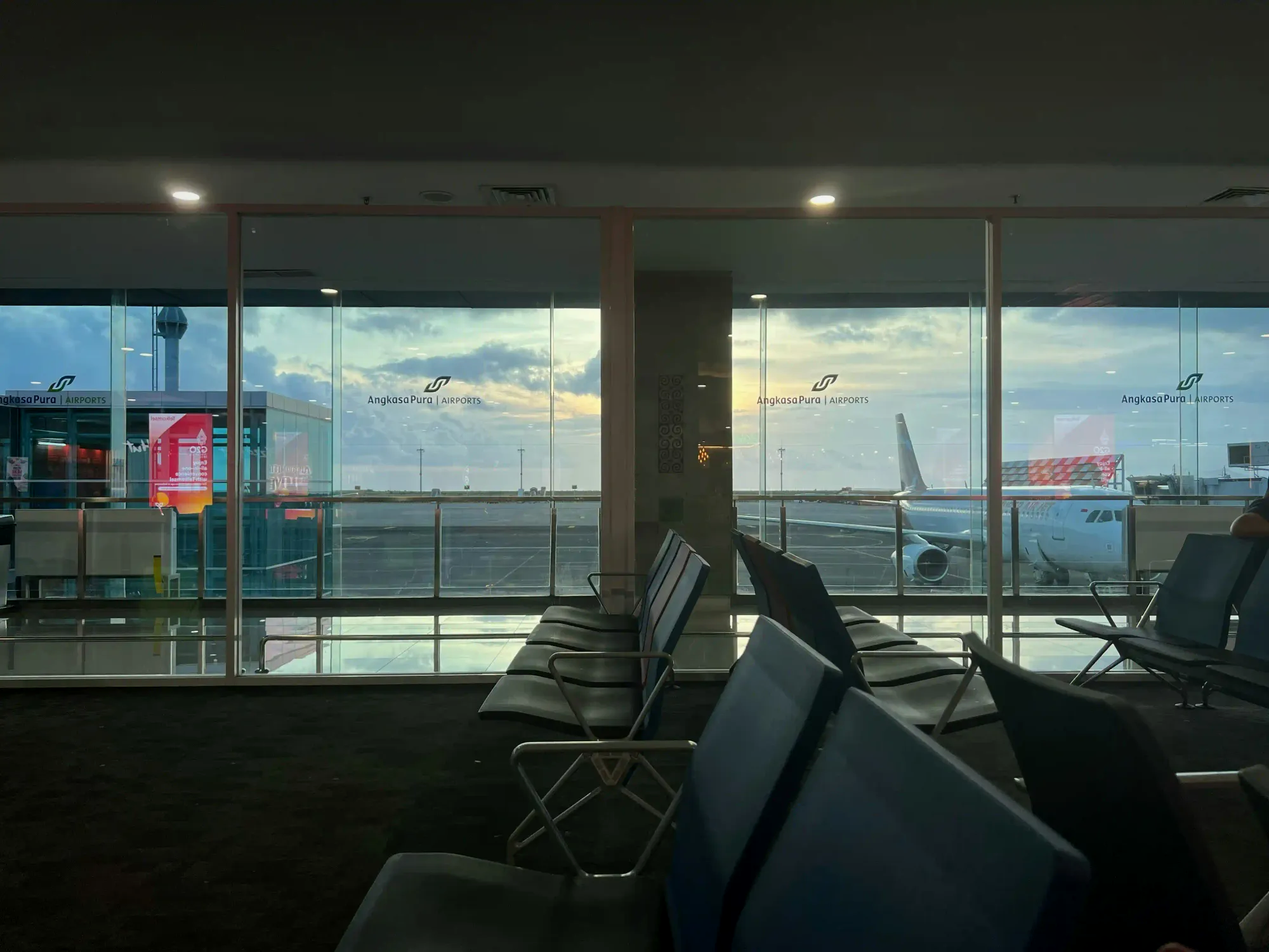 An empty departure lounge at a Bali airport, symbolizing the recent wave of visa cancellations and deportations.