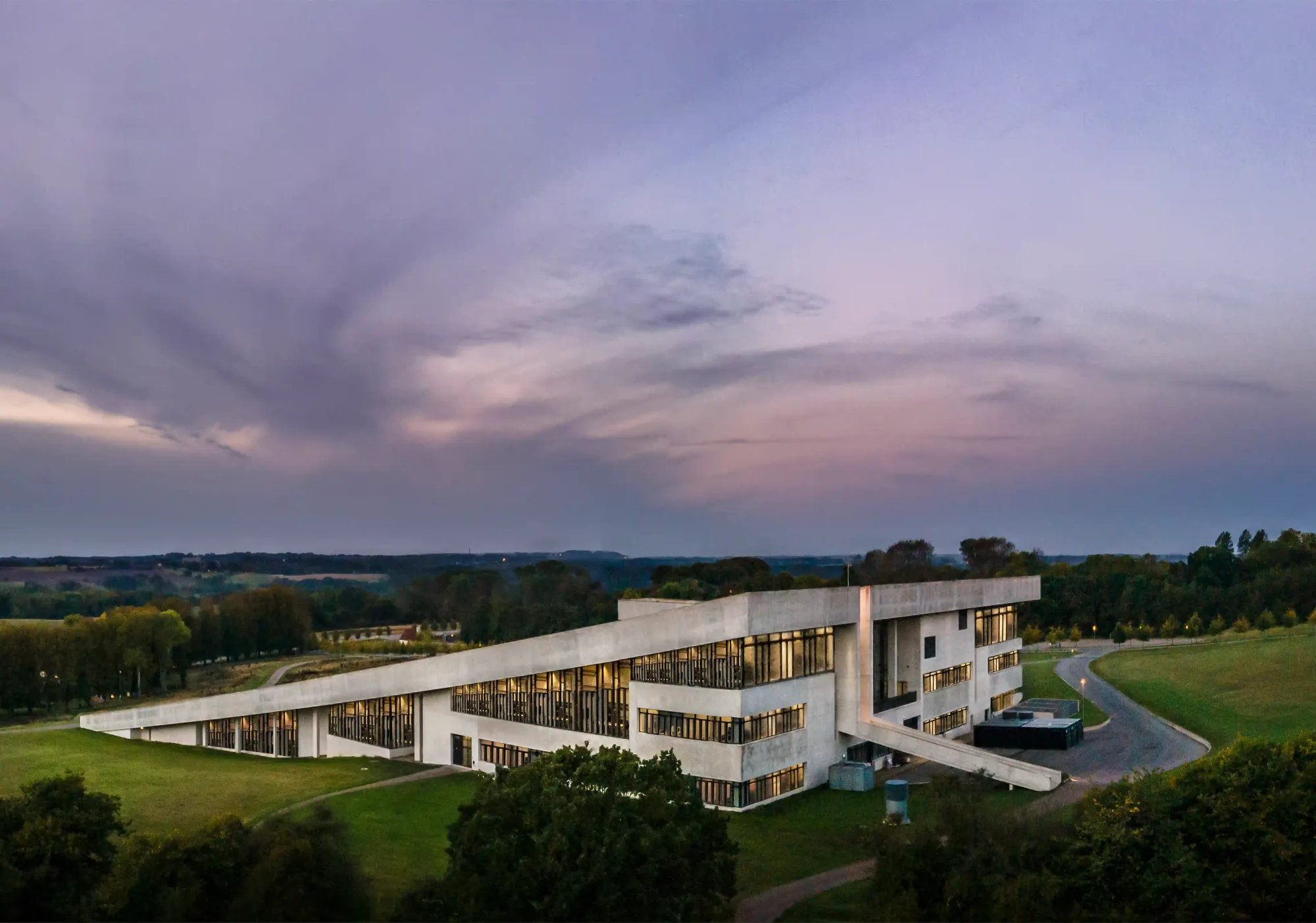 The Moesgaard Museum building rising organically from the landscape with a massive angled grass roof.