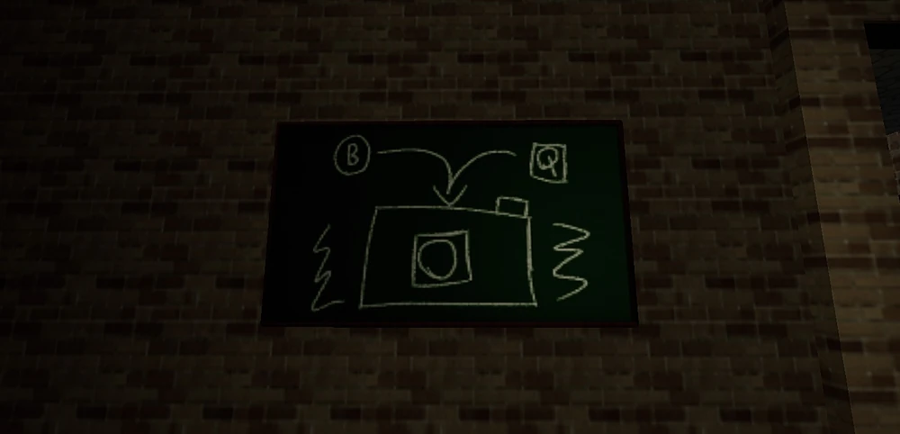 A chalk drawing on a wall of a camera, telling the player to press B or Q to use it.