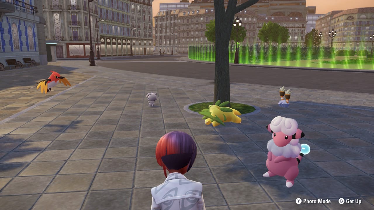Sitting on a bench that's not visible from the angle, the protagonist looks at their team (Fletchinder, Espurr, Bayleef, Binacle and Flaaffy) loafing around.