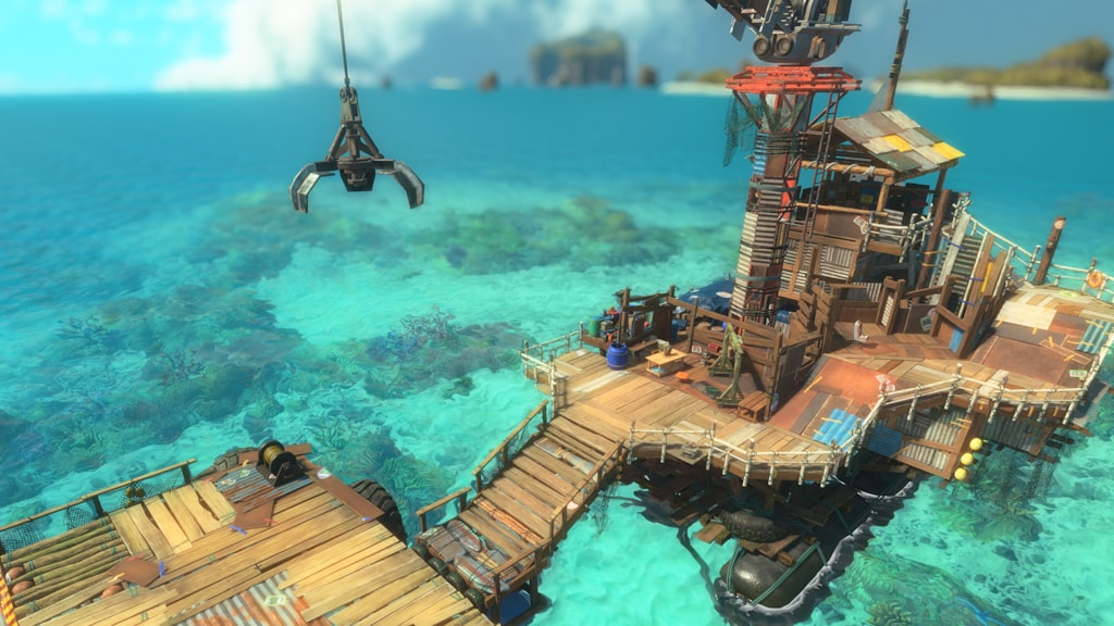 A ramshackle floating base of operations built from scavenged wood and metal, complete with a crane arm, rising out of turquoise tropical water in Splatoon Raiders.