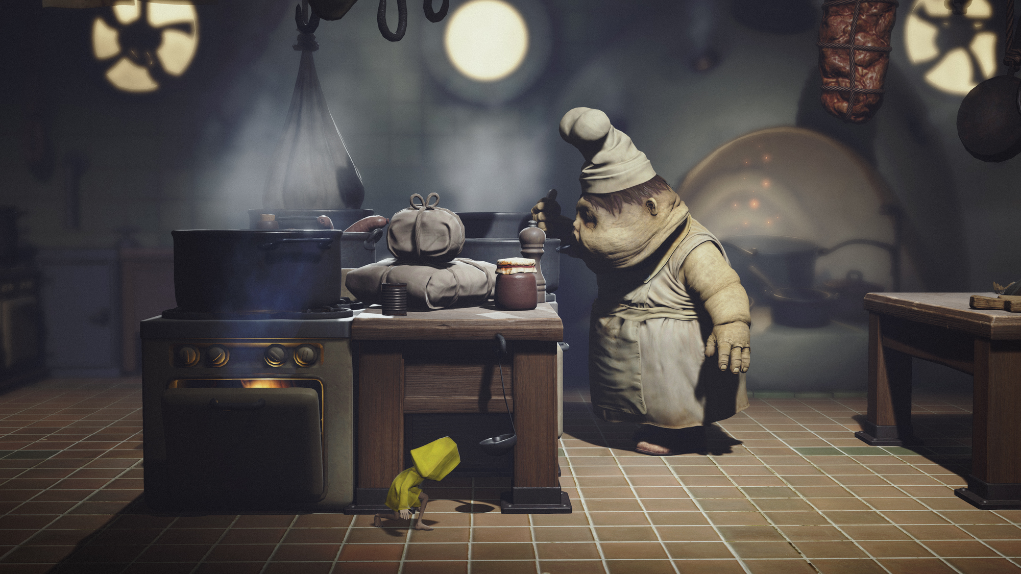 Little Nightmares: two bulbous, sagging-faced chefs work in a grimy kitchen while a tiny girl in a yellow raincoat creeps past under the table.