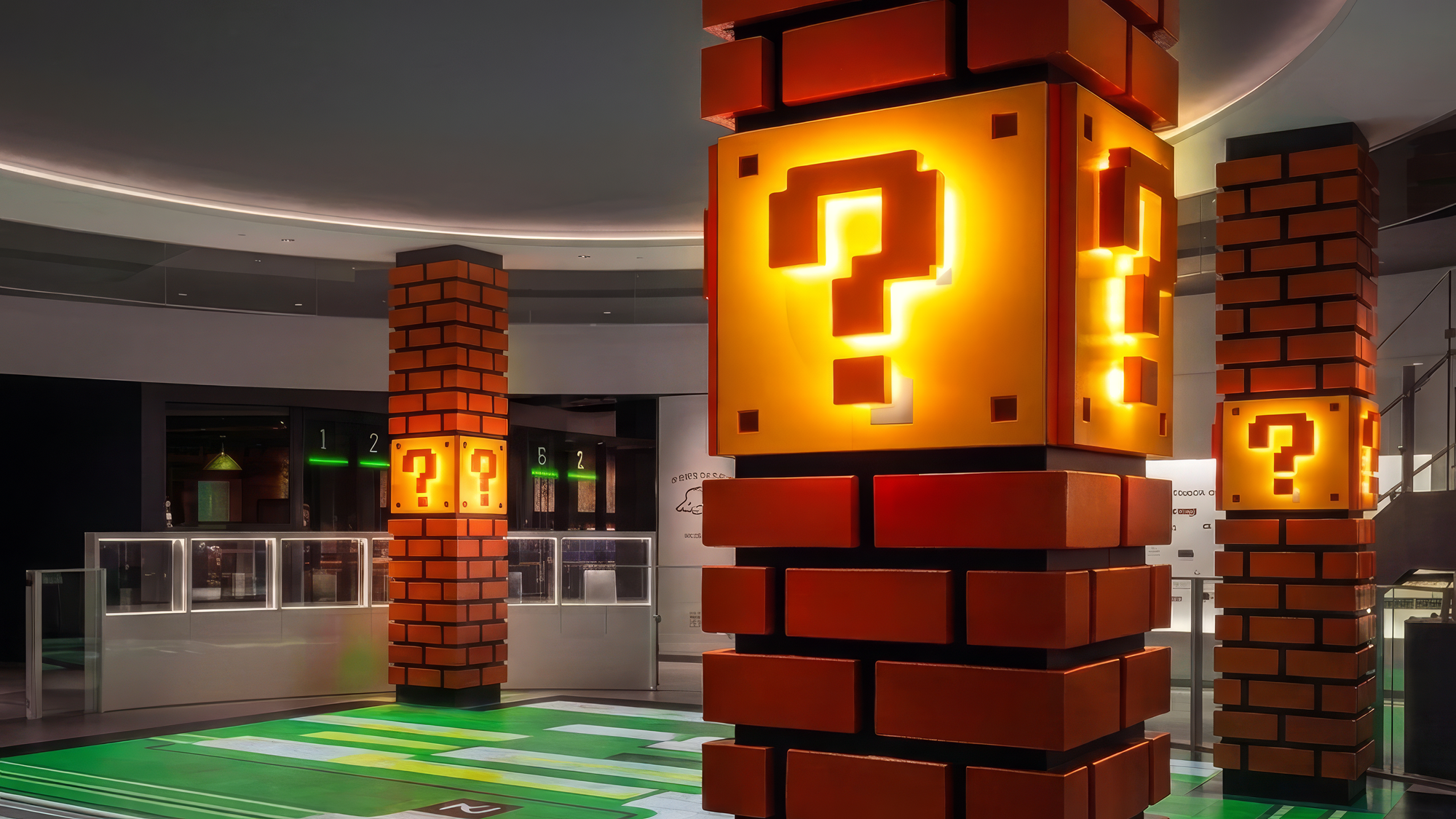 Brick pillars and a glowing yellow question mark block from Super Mario in the lobby of the Nintendo Museum in Kyoto.