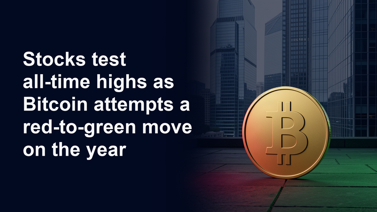 Gold Bitcoin coin with red and green light against navy city skyscrapers, beside the headline: Stocks test all-time highs as Bitcoin attempts a red-to-green move on the year