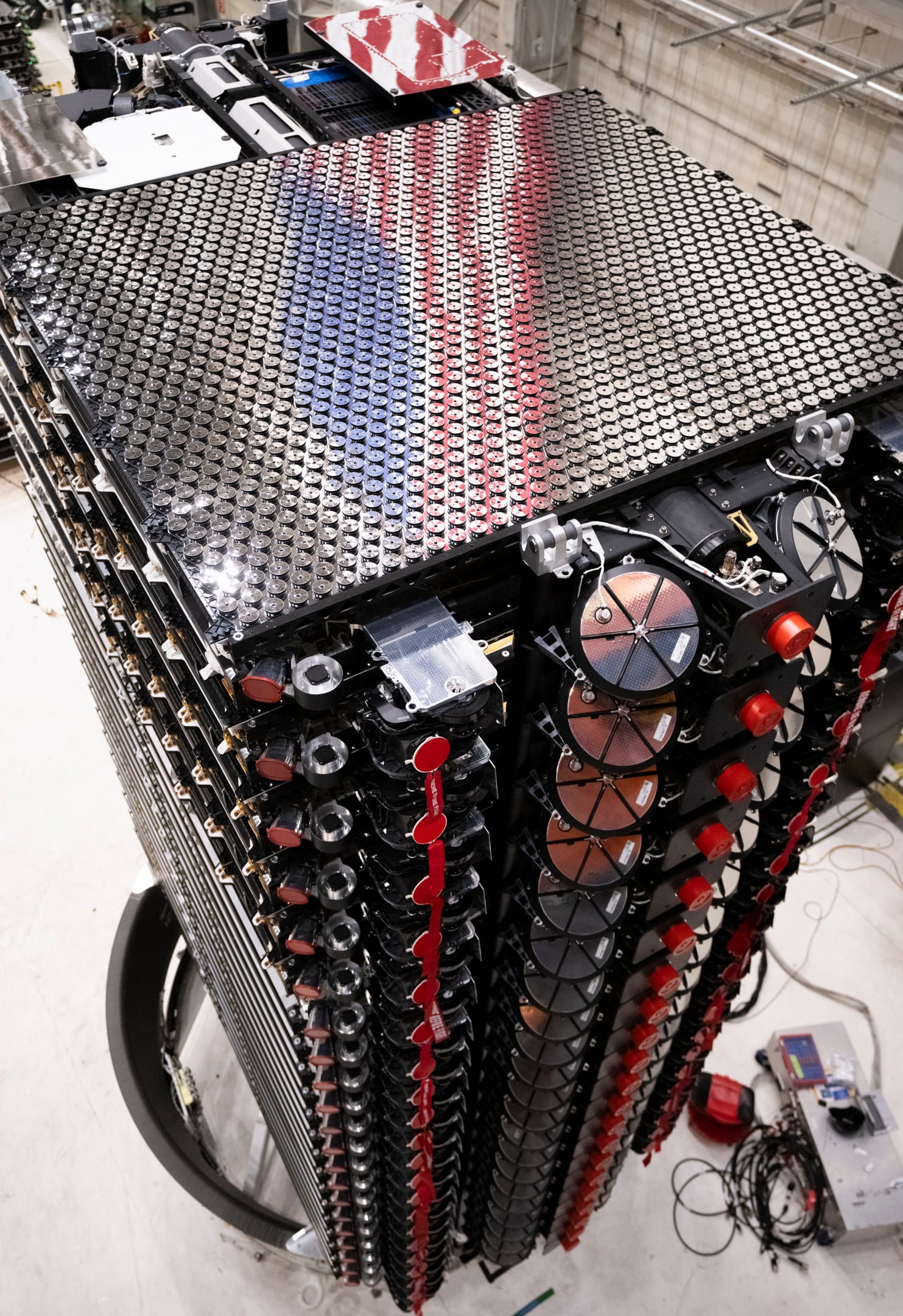 SpaceX's Starlink satellites in a payload processing facility at Vandenberg Space Force base. ©SpaceX