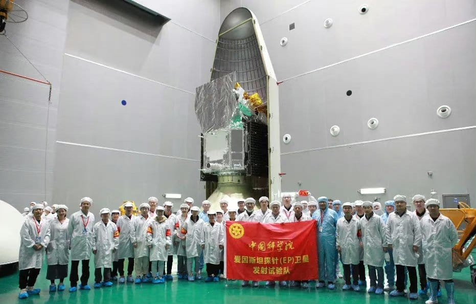 The Einstein Probe during payload encapsulation with its team in the foreground.