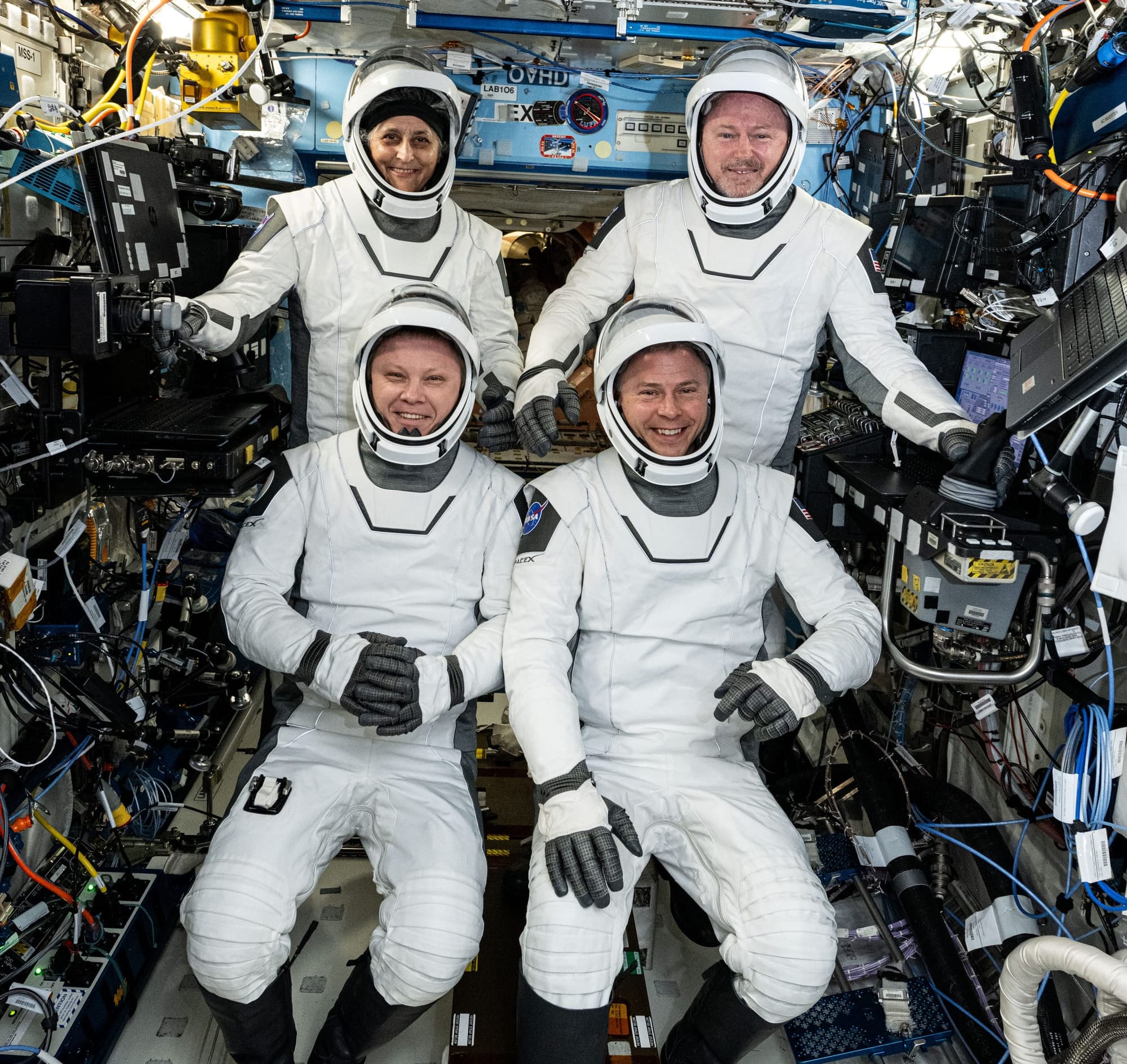 The Crew-9 astronauts in their SpaceX spacesuits ahead of their departure from the station; Suni Williams (top left), Butch Wilmore (top right), Aleksandr Gorbunov (bottom left), and Nick Hague (bottom right). ยฉNASA