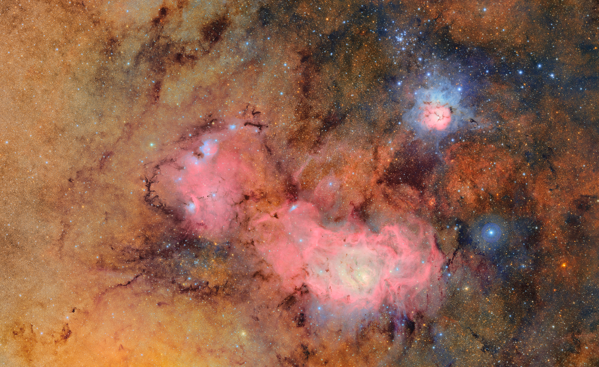 Clouds of gas and dust comprising the Trifid and Lagoon nebula's. ©National Science Foundation/Department of Energy/Vera C. Rubin Observatory