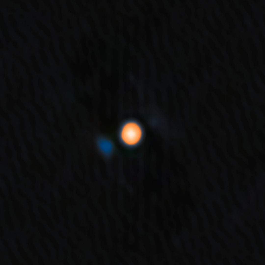 An image of Betelgeuse, the yellow-red star, and the signature of its close companion, the faint blue object. ยฉNational Optical-Infrared Astronomy Research Laboratory/NASA/Jet Propulsion Laboratory