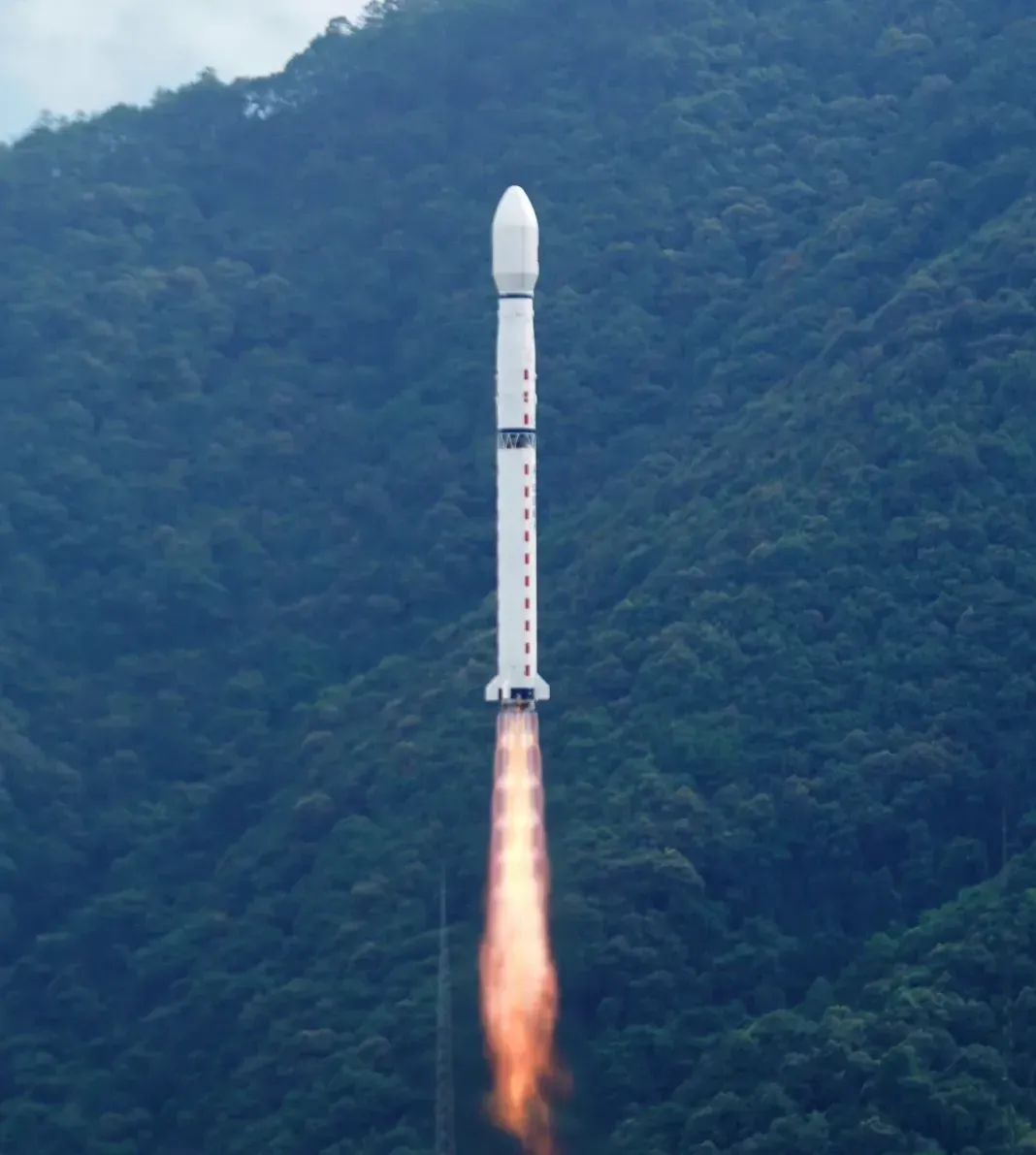 The Long March 4C Y64 vehicle during first-stage flight from the Xichang Satellite Launch Center.