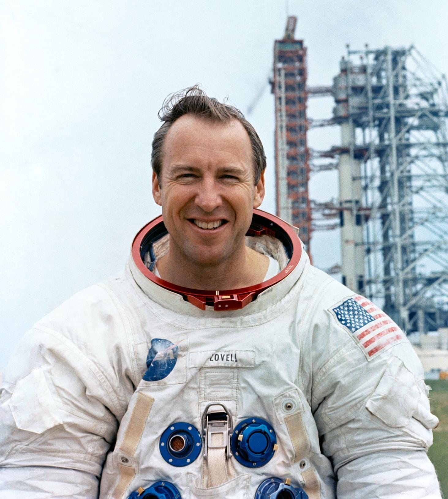 Jim Lovell pictured before the Apollo 13 mission in front of the mission's Saturn V rocket. ยฉNASA