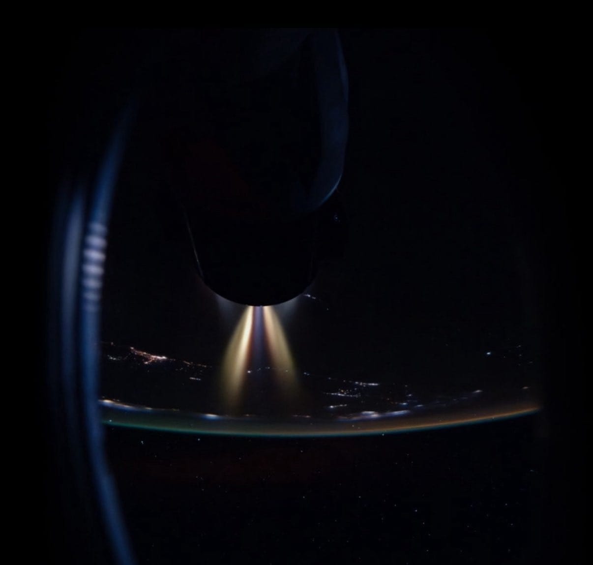 The CRS-33 Cargo Dragon seen from the Crew-11's Crew Dragon performing an orbit boosting demonstration while docked to the International Space Station. ยฉNASA