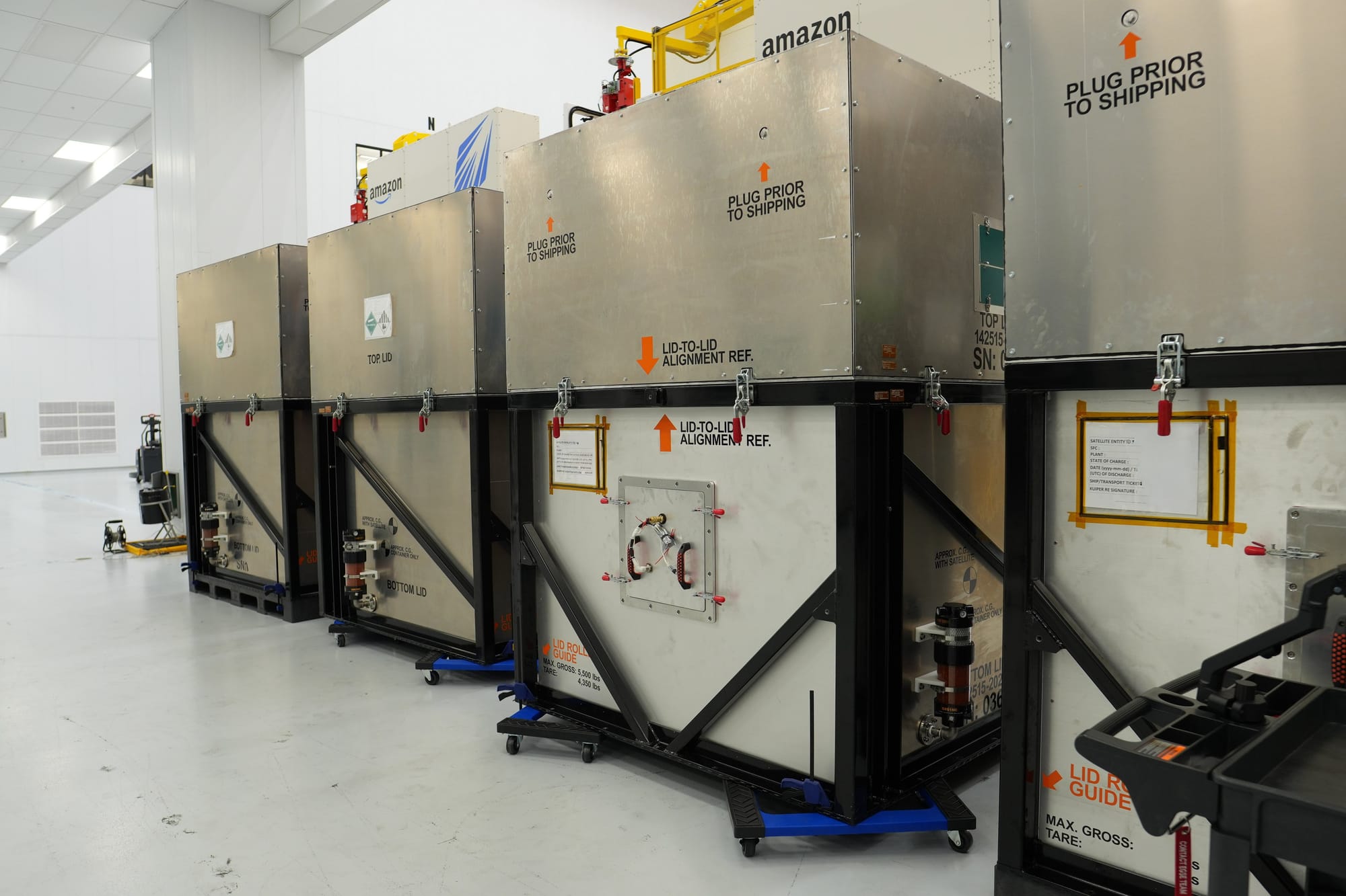 Climate-controlled containers housing Amazon Leo satellites in a Florida processing facility ahead of delivery to French Guiana. ยฉAmazon