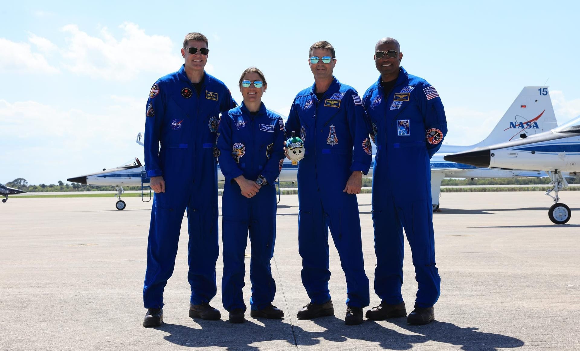 Artemis II's Jeremy Hansen (left), Christina Koch (center left), Reid Wiseman (center right), and Victor Glover (right) after arriving at the Kennedy Space Center on March 27th 2026. ©Kim Shiflett/NASA