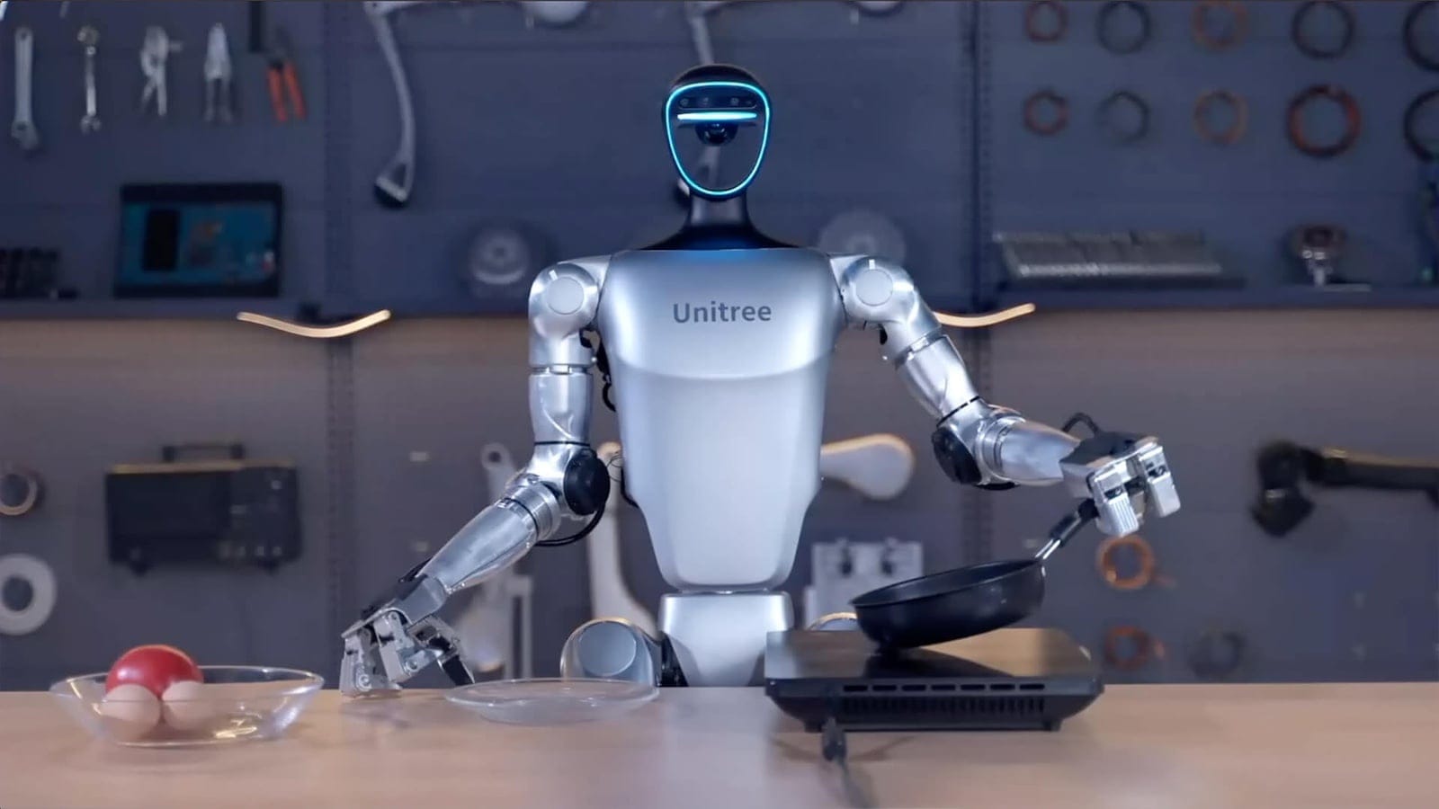 A Unitree G1 robot cooking during a demonstration