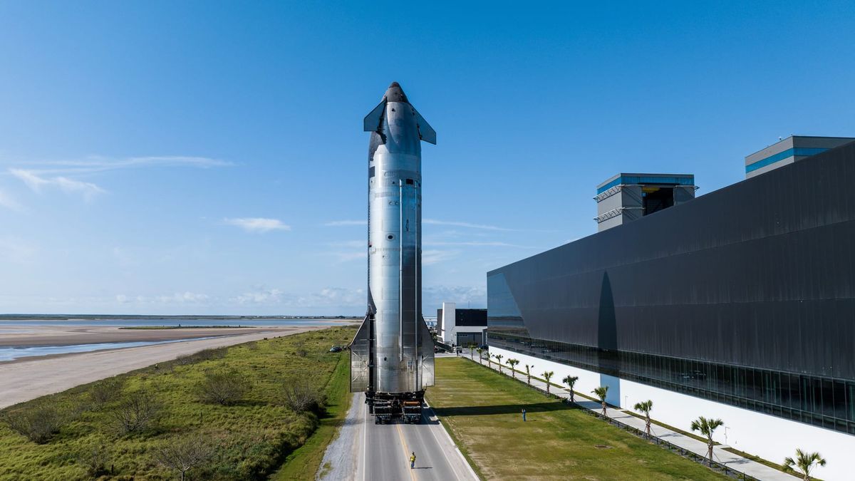 Ship 34 rolling past the production site at SpaceX's Starbase facility. ©SpaceX