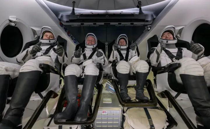 Crew-11's four astronauts onboard Crew Dragon after their return to Earth. ©Bill Ingalls/NASA