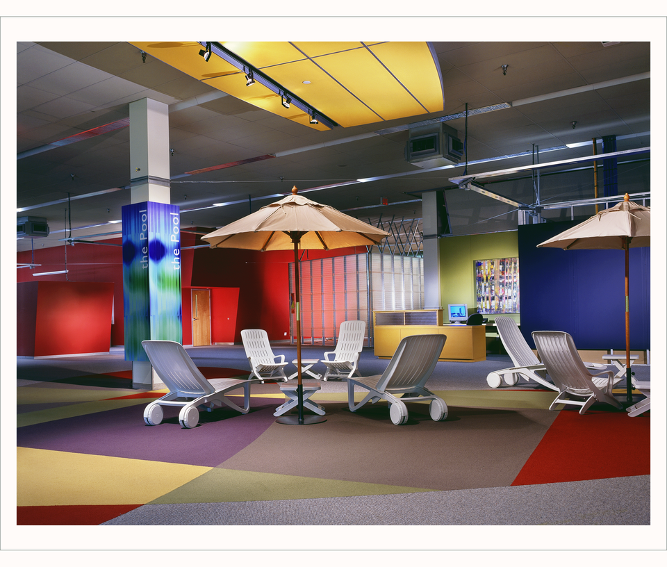 Image courtesy www.techbc.ca, a historical archive of TechBC memories. Photo of "the Pool" seating area with bright carpets and walls.