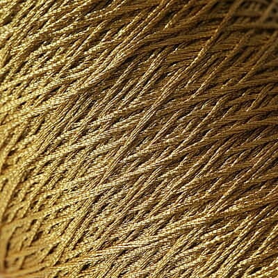 Gold metallic yarn rolls for textile manufacturing