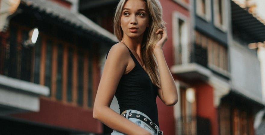 woman touching her ear