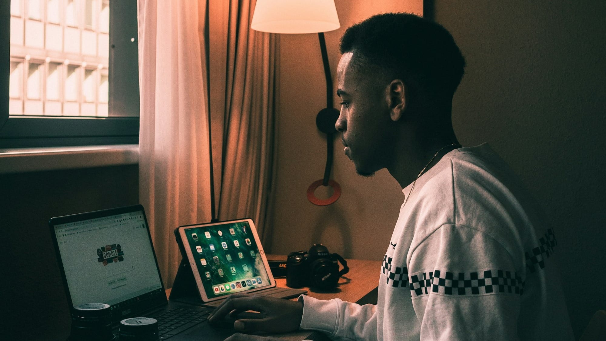 man using laptop inside room