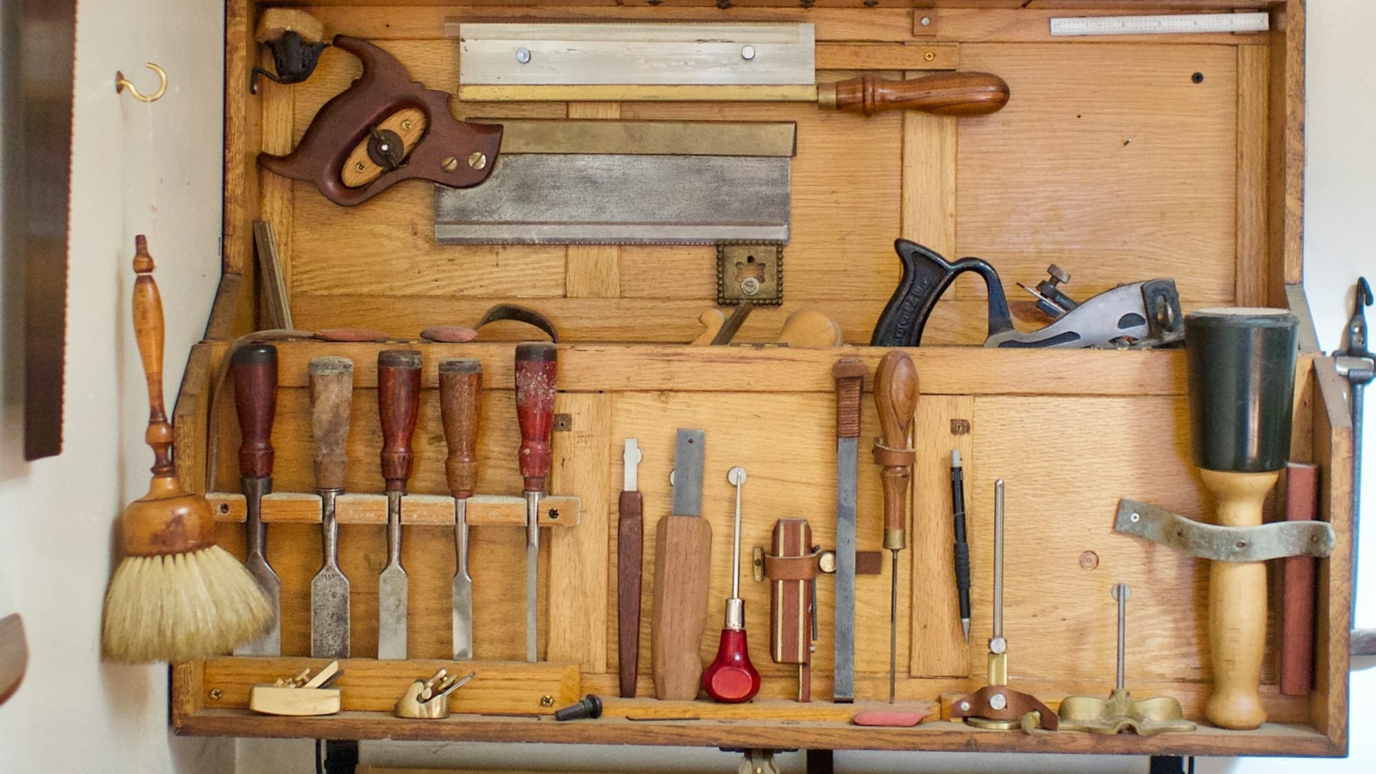 a workbench filled with lots of tools