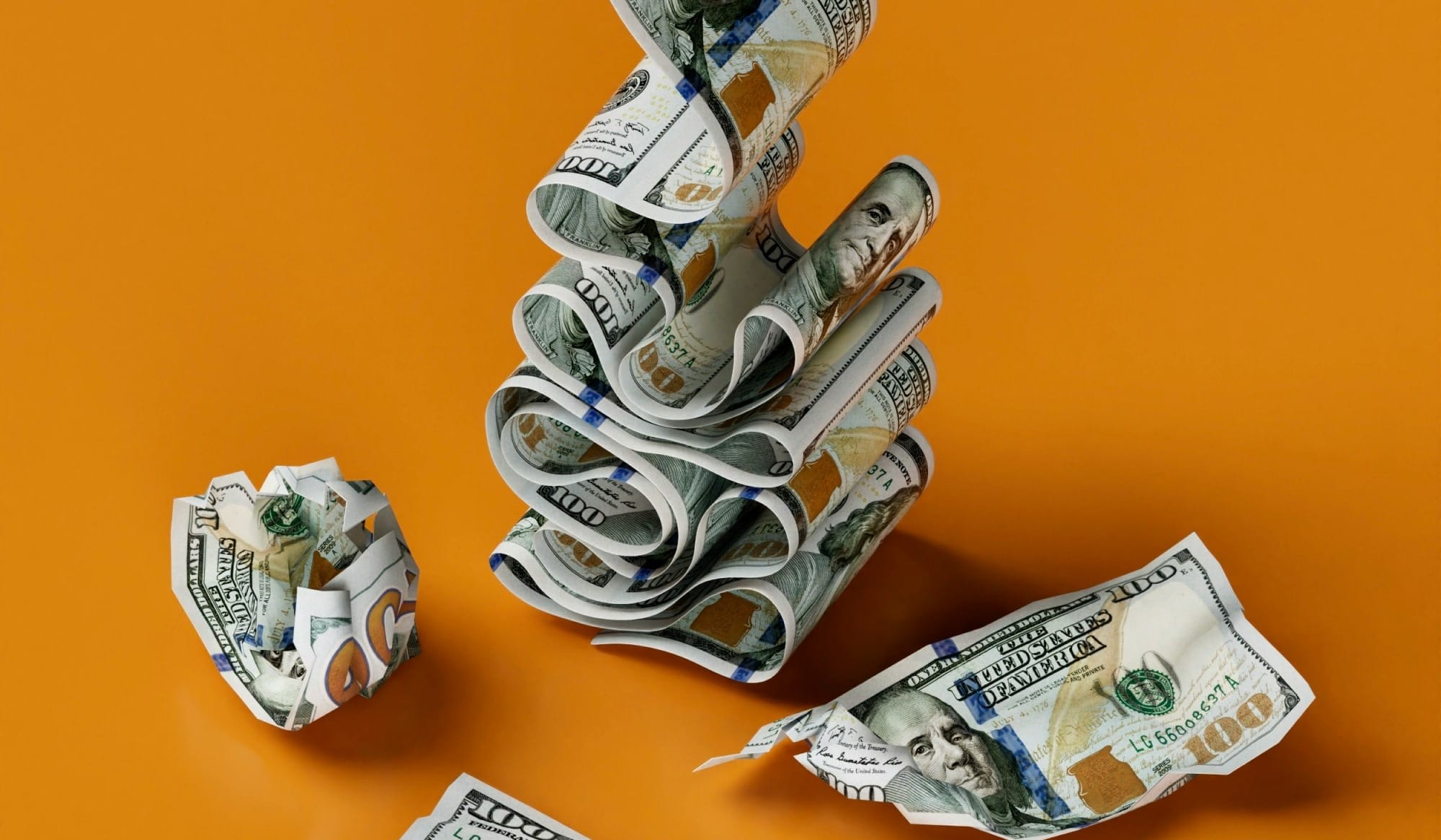 a stack of money sitting on top of a table