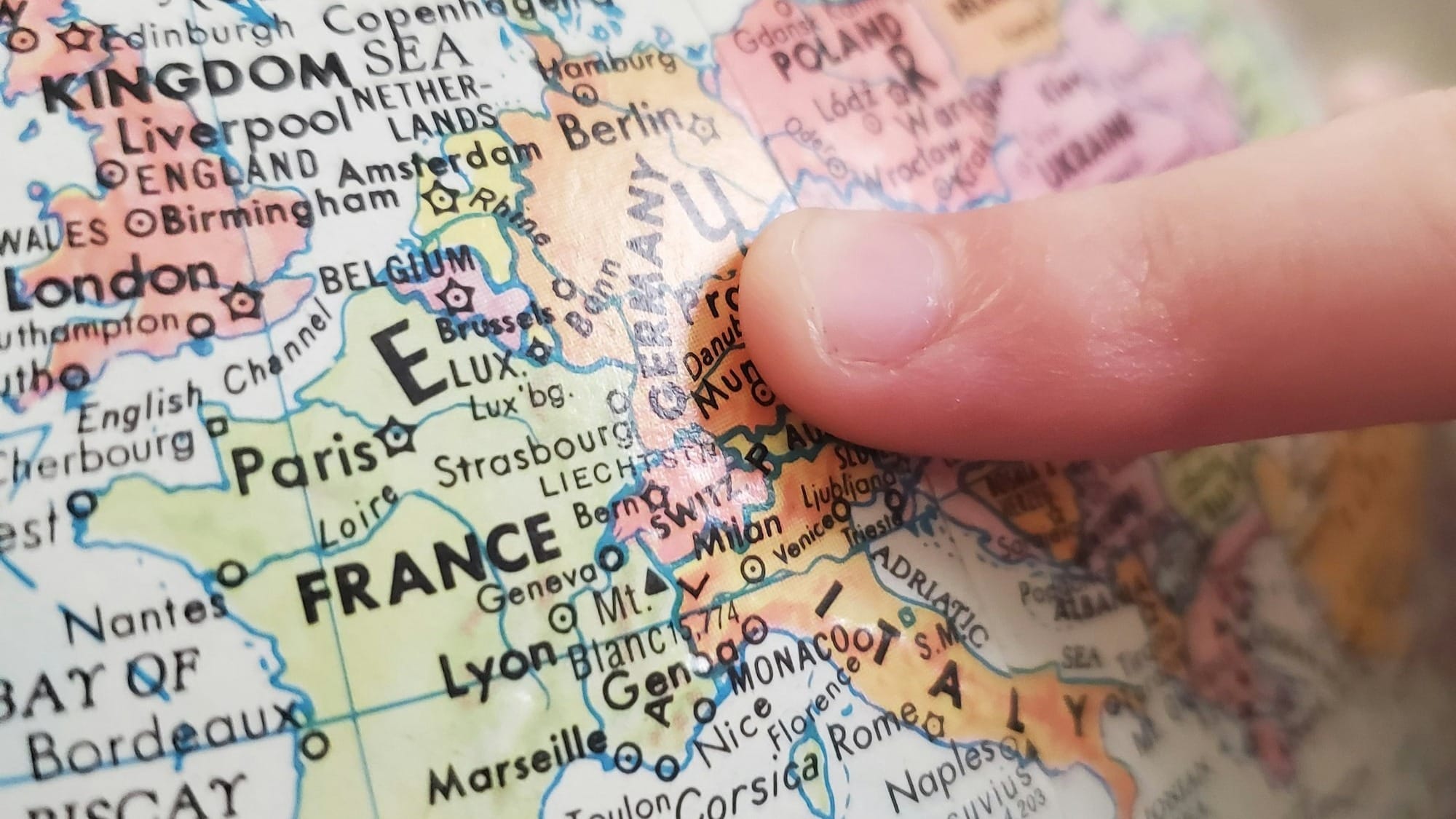 person holding white and blue map