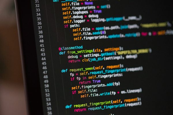 Lines of source code on a dark computer screen