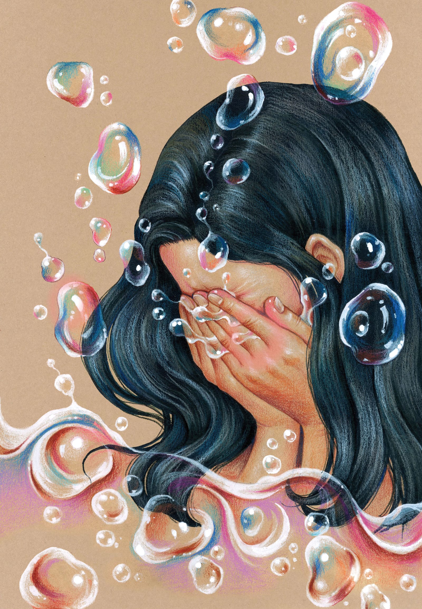 A brown-skinned person with long hair and their face in their hands. Iridescent bubbles float around them.