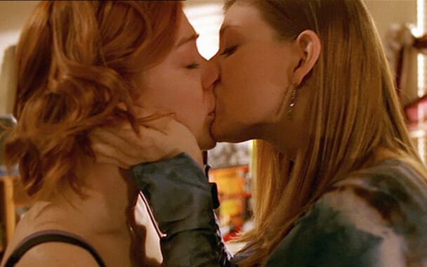 Screenshot: Tara and Willow, two white women characters, kiss passionately with their eyes closed
