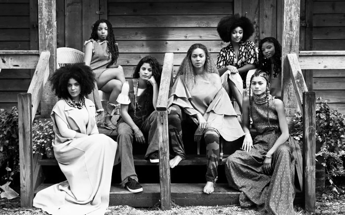 Beyoncé, Zendaya, Chloe Bailey, Halle Bailey, Amandla Stenberg, and other Black women sit together on a wooden porch