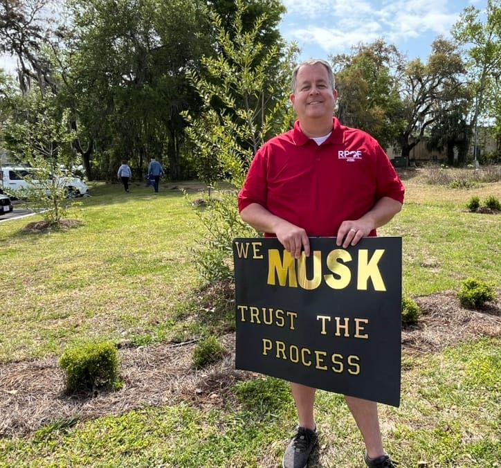 Alachua County Republican Party Chairman Gives Interview at ‘Tesla Takedown’ Protest