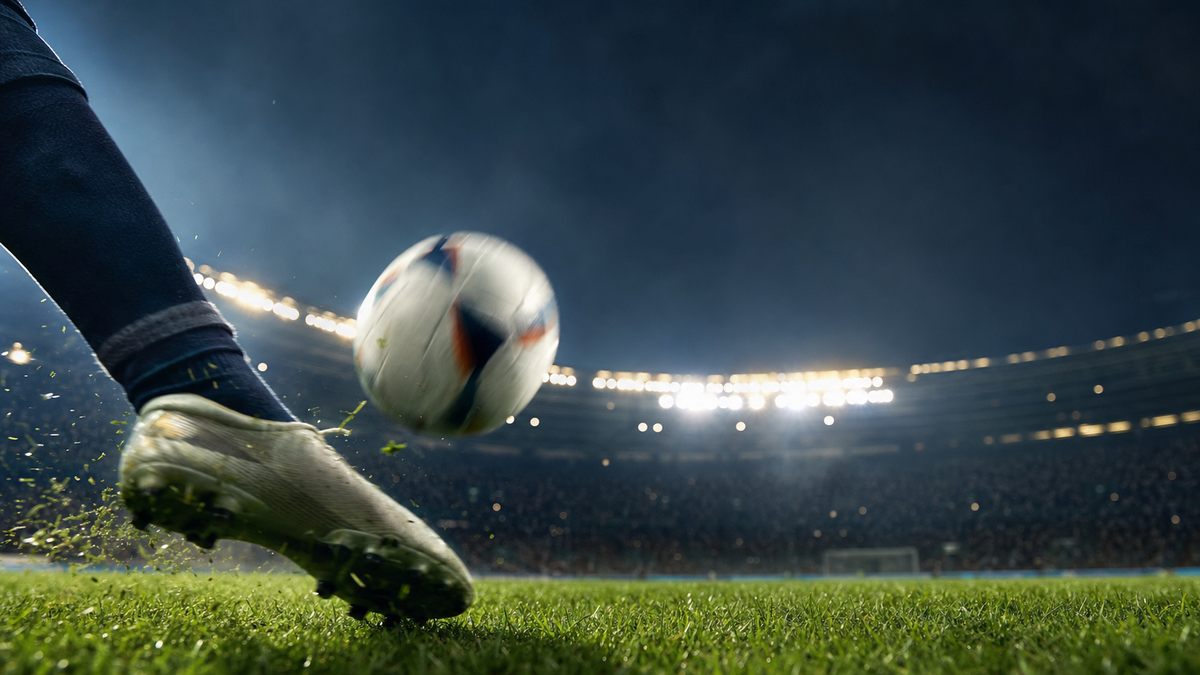 Football being struck on a floodlit pitch — Premier League Round 1 recap hero image.