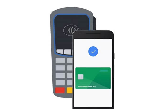Phone next to card machine to complete contacless payment
