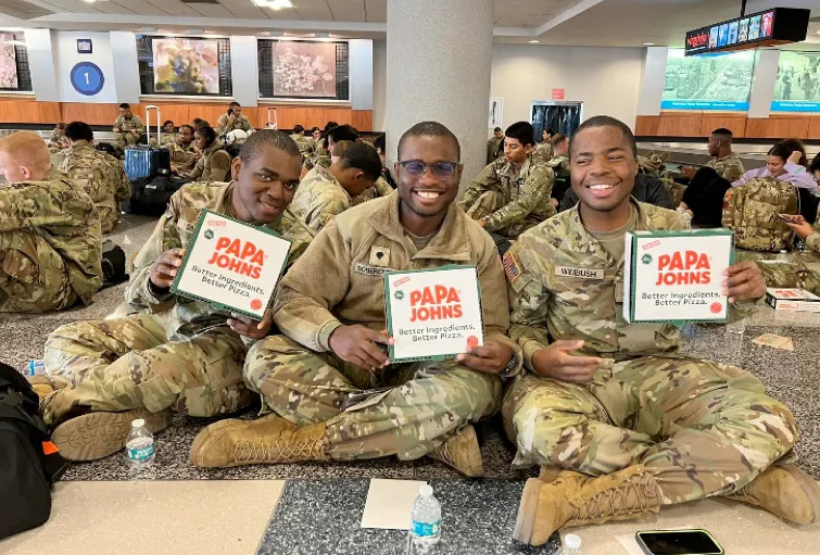 Papa Johns seeks volunteers to help distribute free pizzas to troops returning home Dec. 17-18