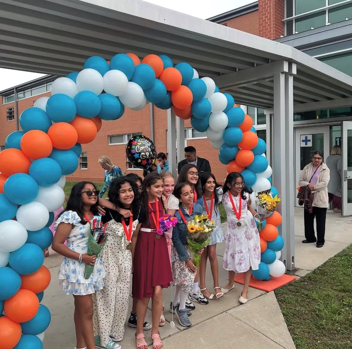 Kaechele ES fifth-graders and  longtime music teacher celebrate their next chapters