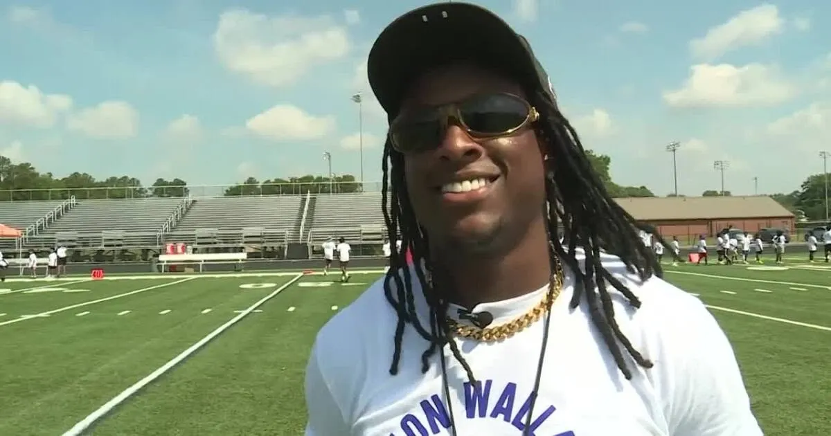 Baltimore Ravens' K'Von Wallace hosts 5th youth football camp at Highland Springs HS