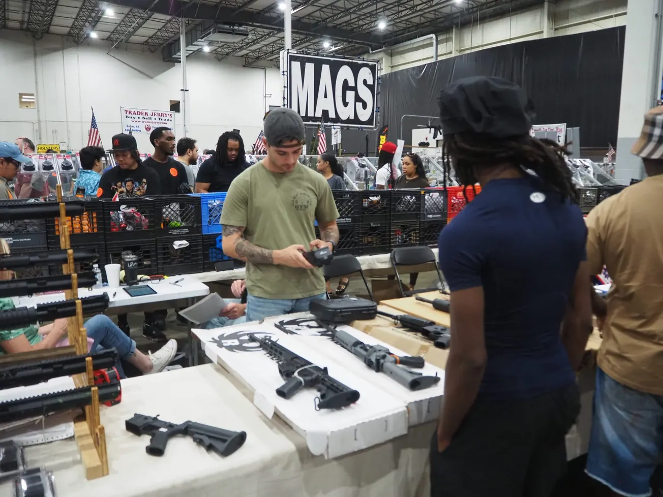 Virginia’s new gun laws motivate buyers to snatch up automatic rifles and more at busy Henrico gun show
