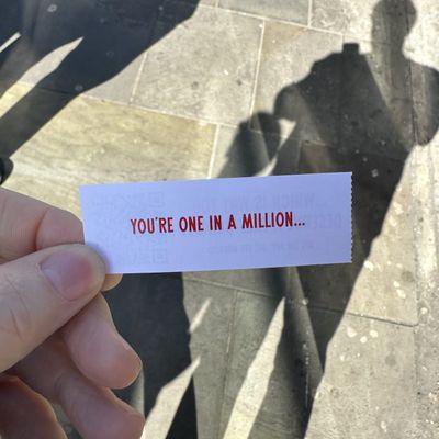 A fortune cookie type slip that says 'You're one in a million'