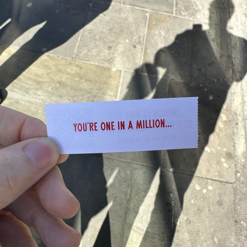 A fortune cookie type slip that says 'You're one in a million'