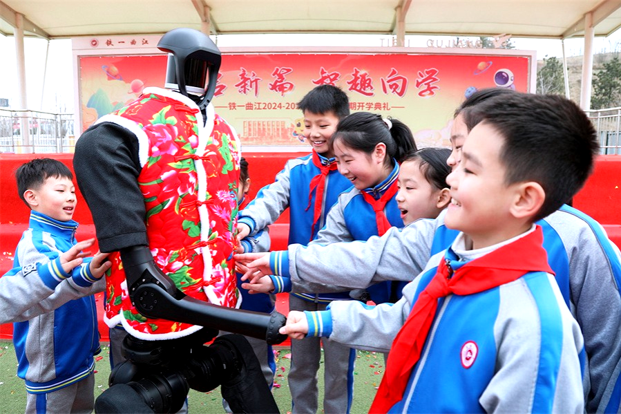 China’s Leadership in AI Education: students playing with a robot