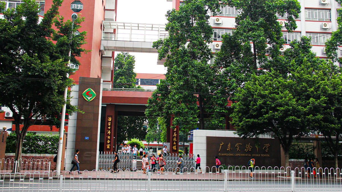Guangdong Experimental High School IFPAD & A-Level entrance, with students gathering near gates and school signage.
