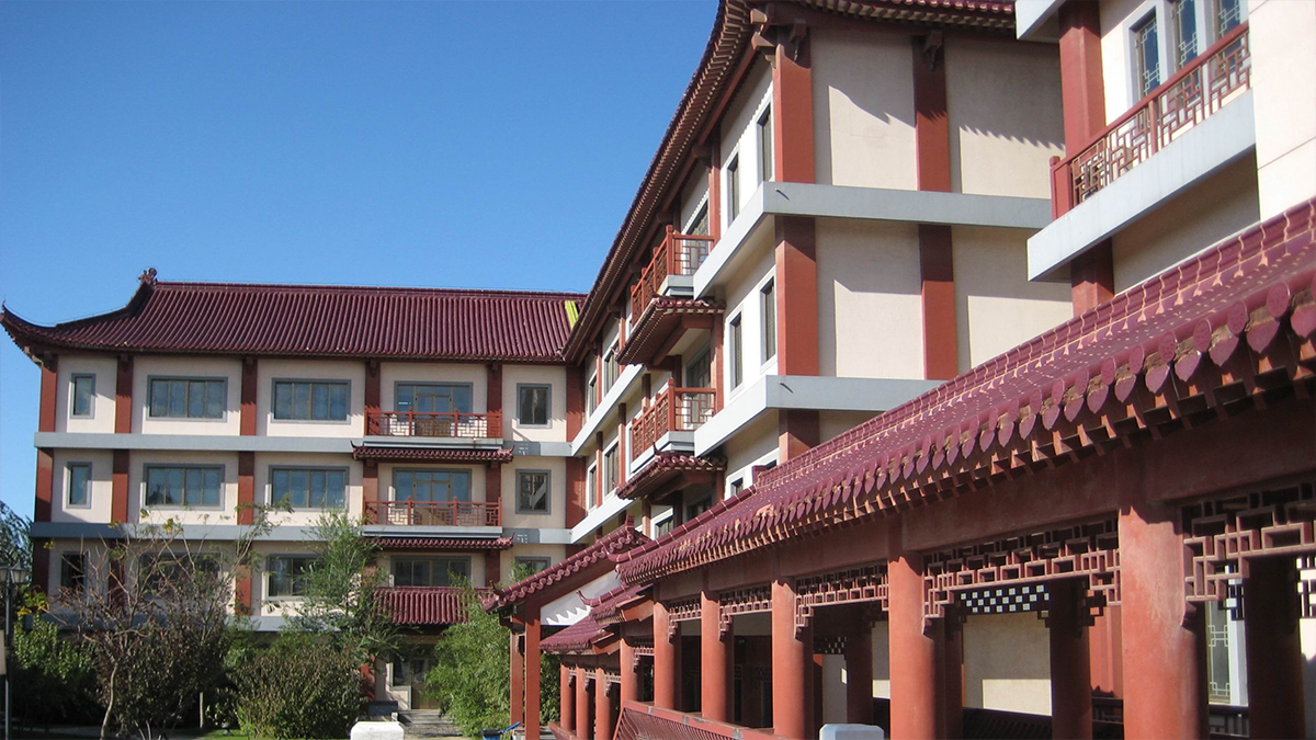 Beijing Bacui Bilingual School buildings with traditional Chinese architecture and modern educational facilities.