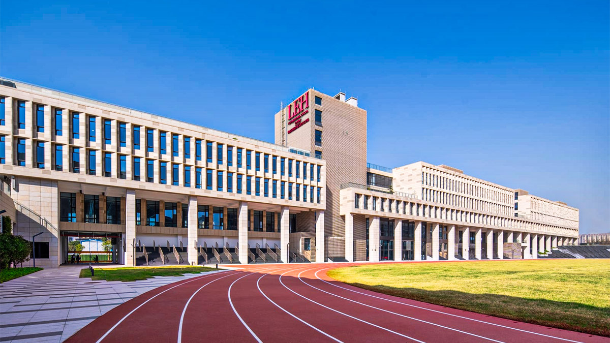 Lady Eleanor Holles International School modern campus with running track and contemporary architecture.