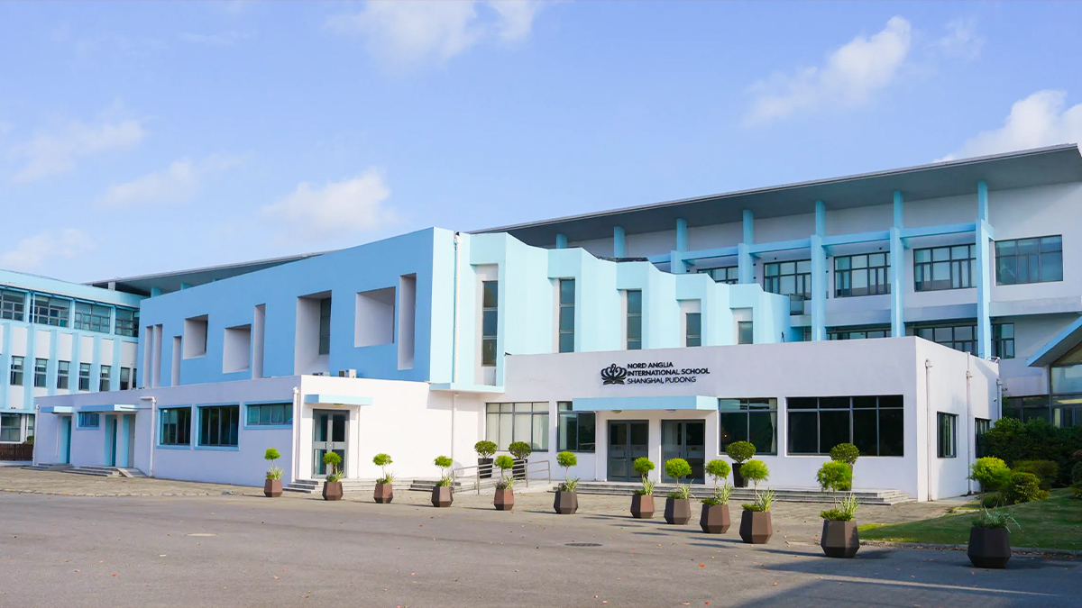 Nord Anglia International School Shanghai Pudong campus featuring modern blue and white architecture design
