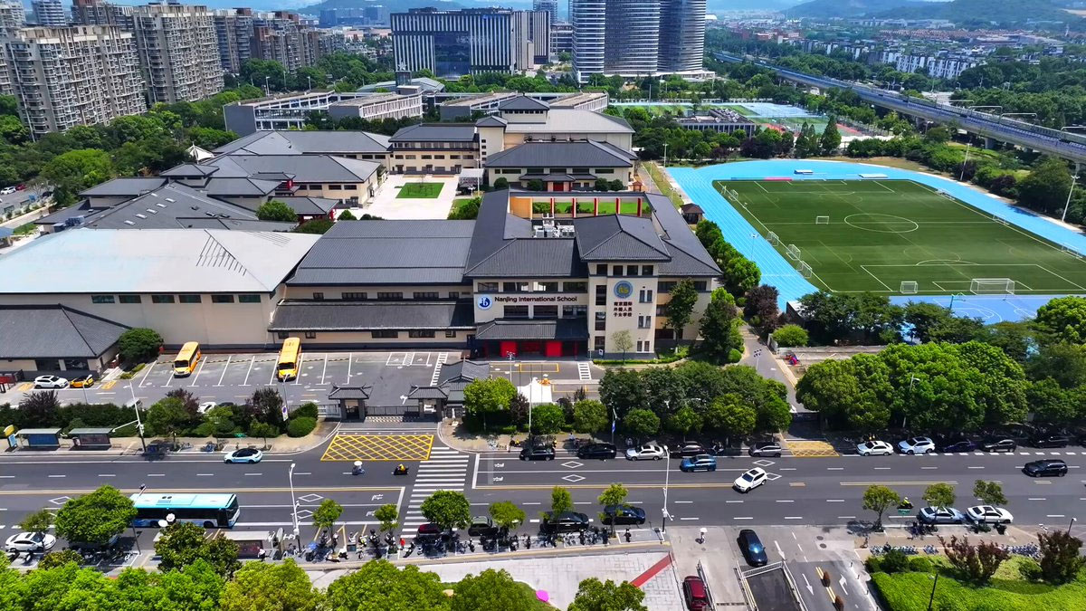 Nanjing International School campus with sports facilities buildings.