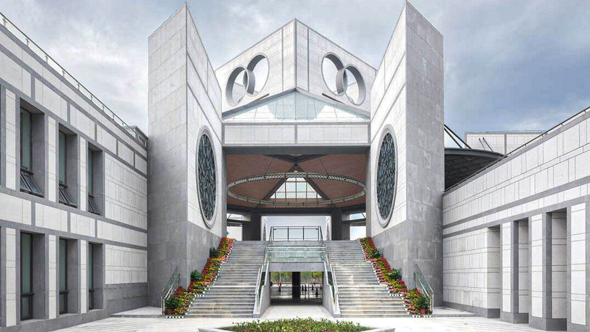UWC Changshu China featuring striking modern architecture with ceremonial staircase and distinctive circular design elements.