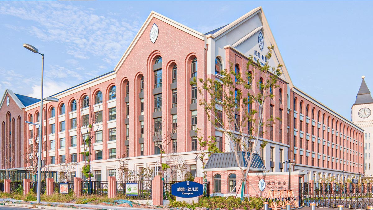 Wycombe Abbey School Nanjing campus featuring traditional brick architecture with arched windows and towers.
