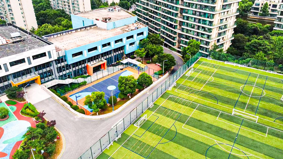 The British School of Nanjing campus with sports fields and buildings.